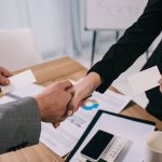 cropped-view-of-business-partners-shaking-hands-an-SUBGQMC