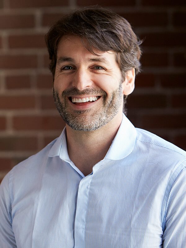 head-and-shoulders-portrait-of-businessman-in-offi-P2DXHCH