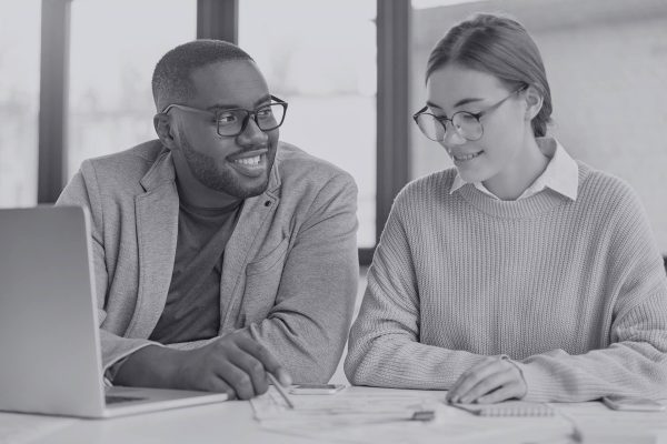 black-prosperous-male-enterpreneur-and-female-assi-FQDESV8