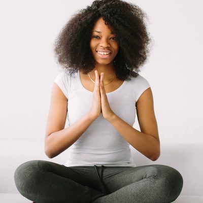 an-african-american-young-women-sitting-in-the-lot-EZUATLG
