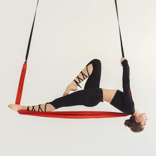 woman-practicing-fly-yoga-over-white-background-PALUKER